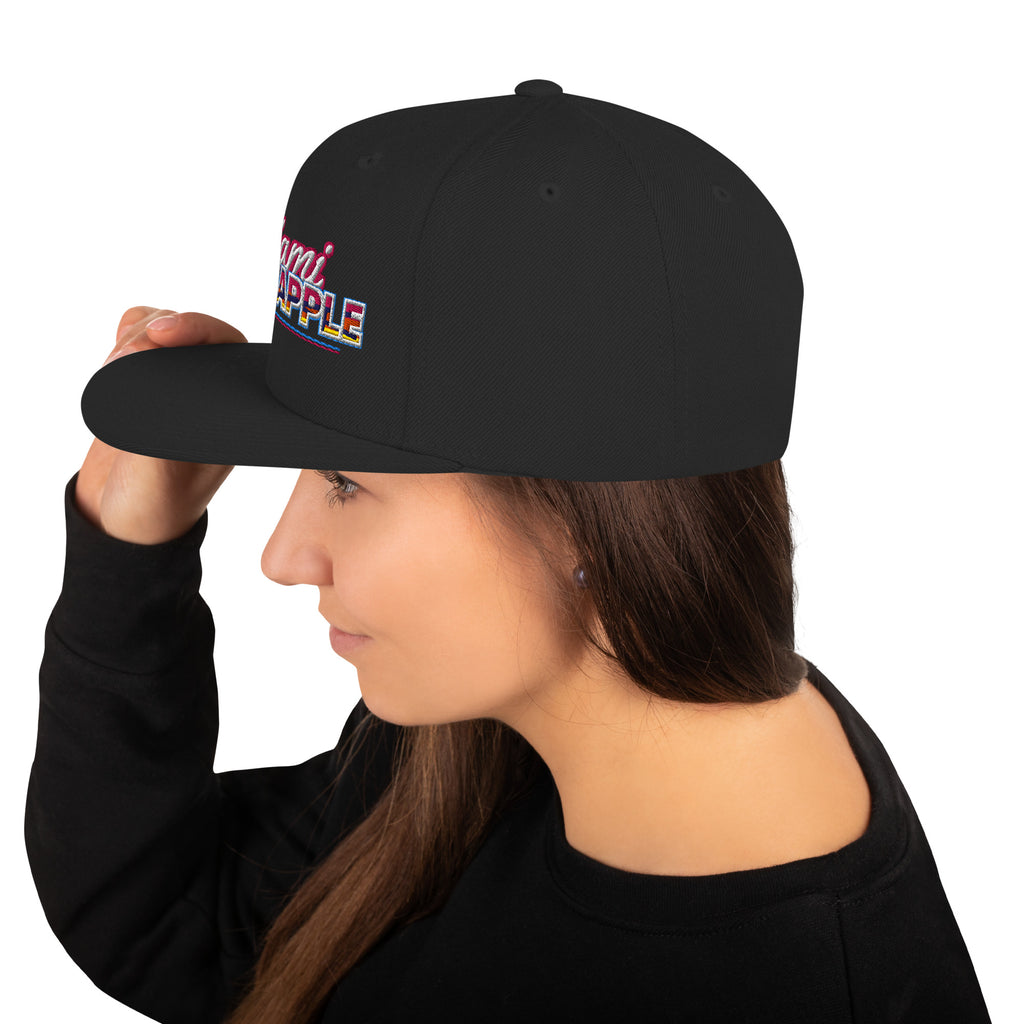 Black flat-brim snapback hat with embroidered Miami P.I.NEAPPLE pineapple logo